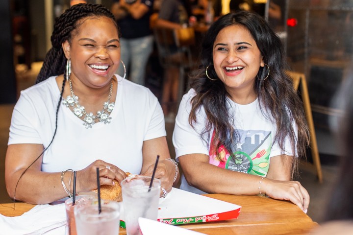 a group of people sitting at a table