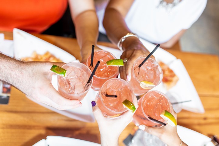 a person sitting at a table with a plate of food