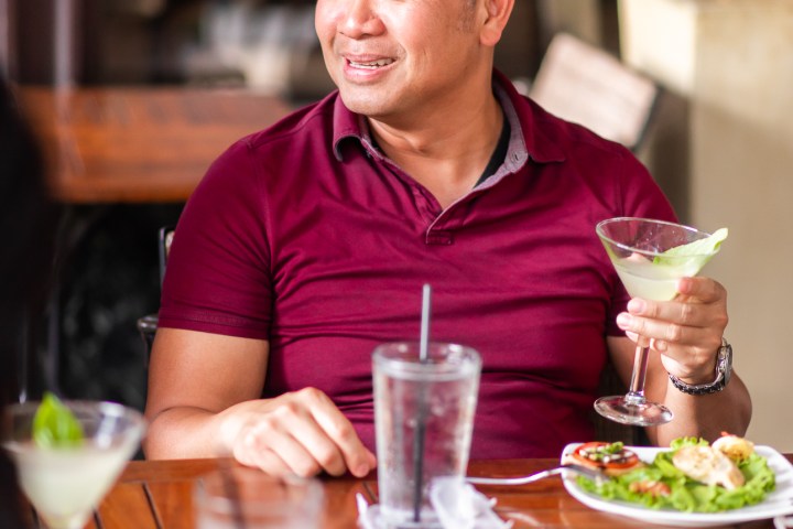 a person sitting at a table in a restaurant