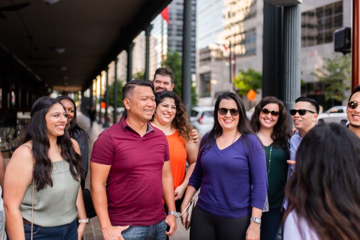 a group of people standing in front of a building