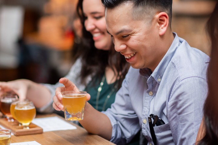 a group of people sitting at a table in a restaurant