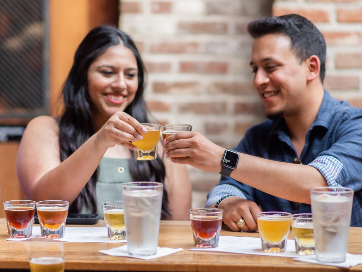 a group of people sitting at a table in a restaurant