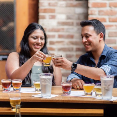 a group of people sitting at a table in a restaurant