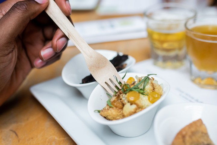 a person sitting at a table with a plate of food