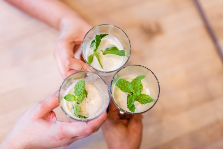 a person holding a bowl of food